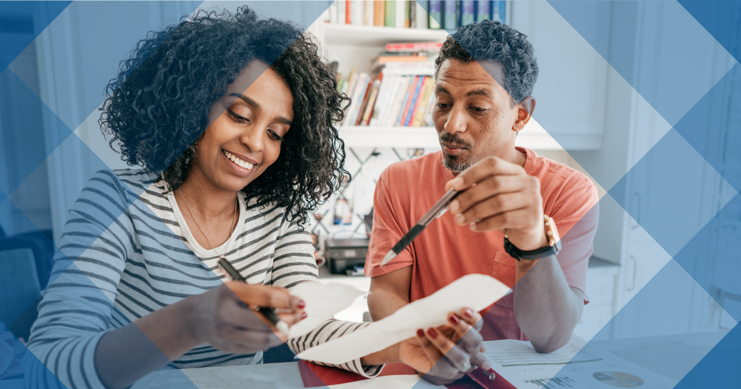 Man and Woman working on their taxes. 