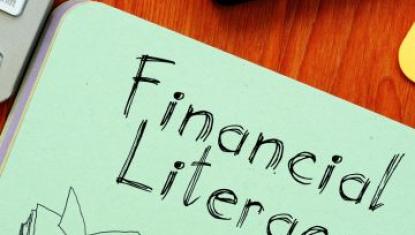 The words "Financial Literacy" written on a piece of paper